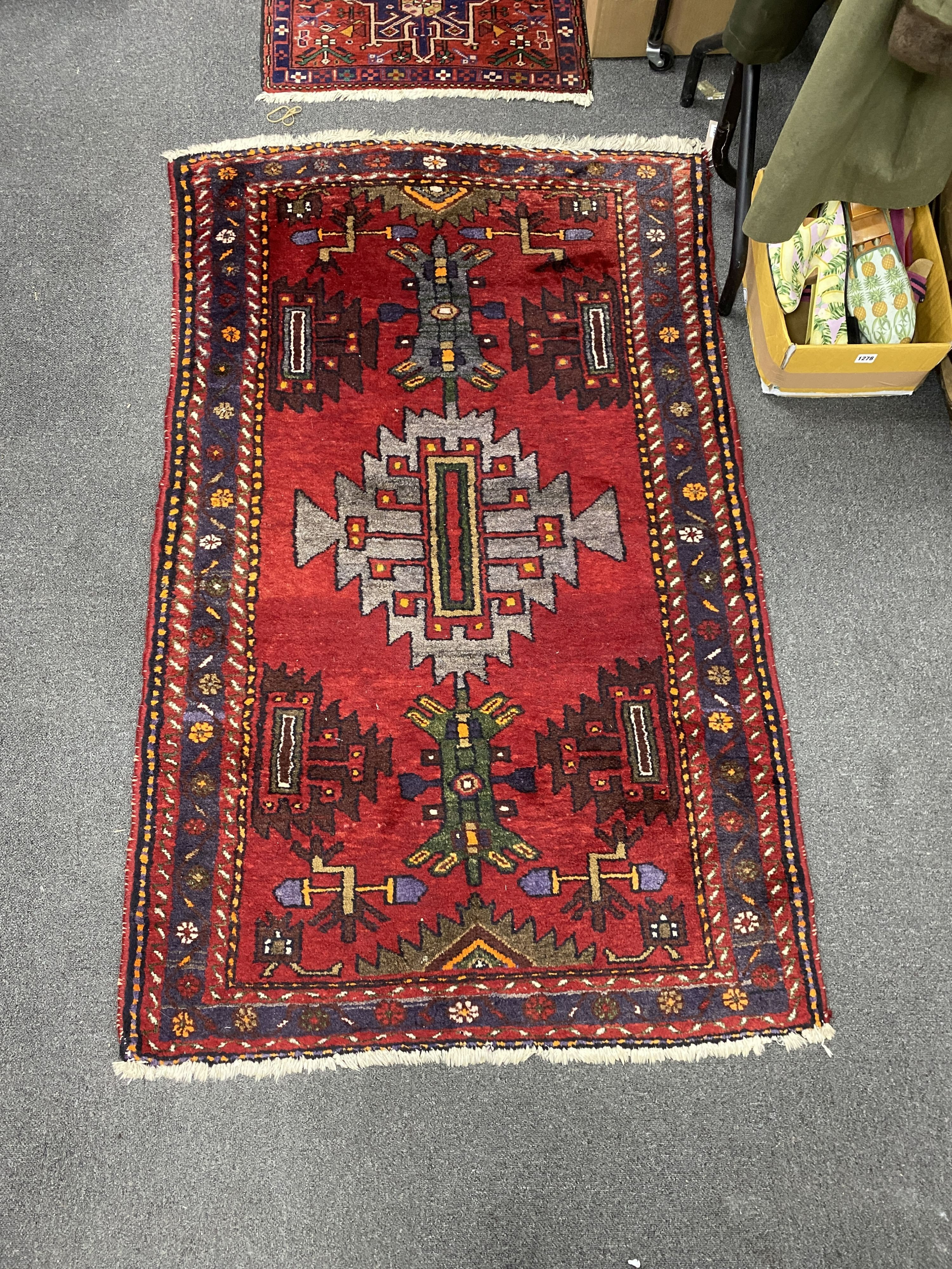 A Caucasian red ground rug, 160 x 100cm and similar runner